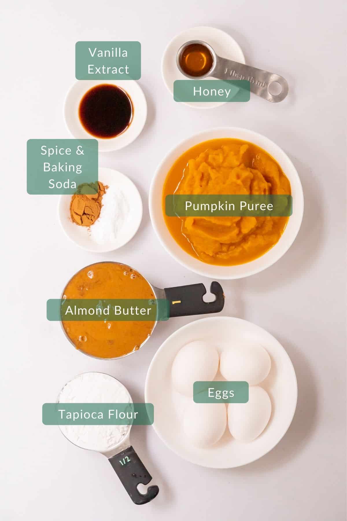 Overhead view of the 8 healthy ingredients you need to make paleo pumpkin pancakes with almond butter.