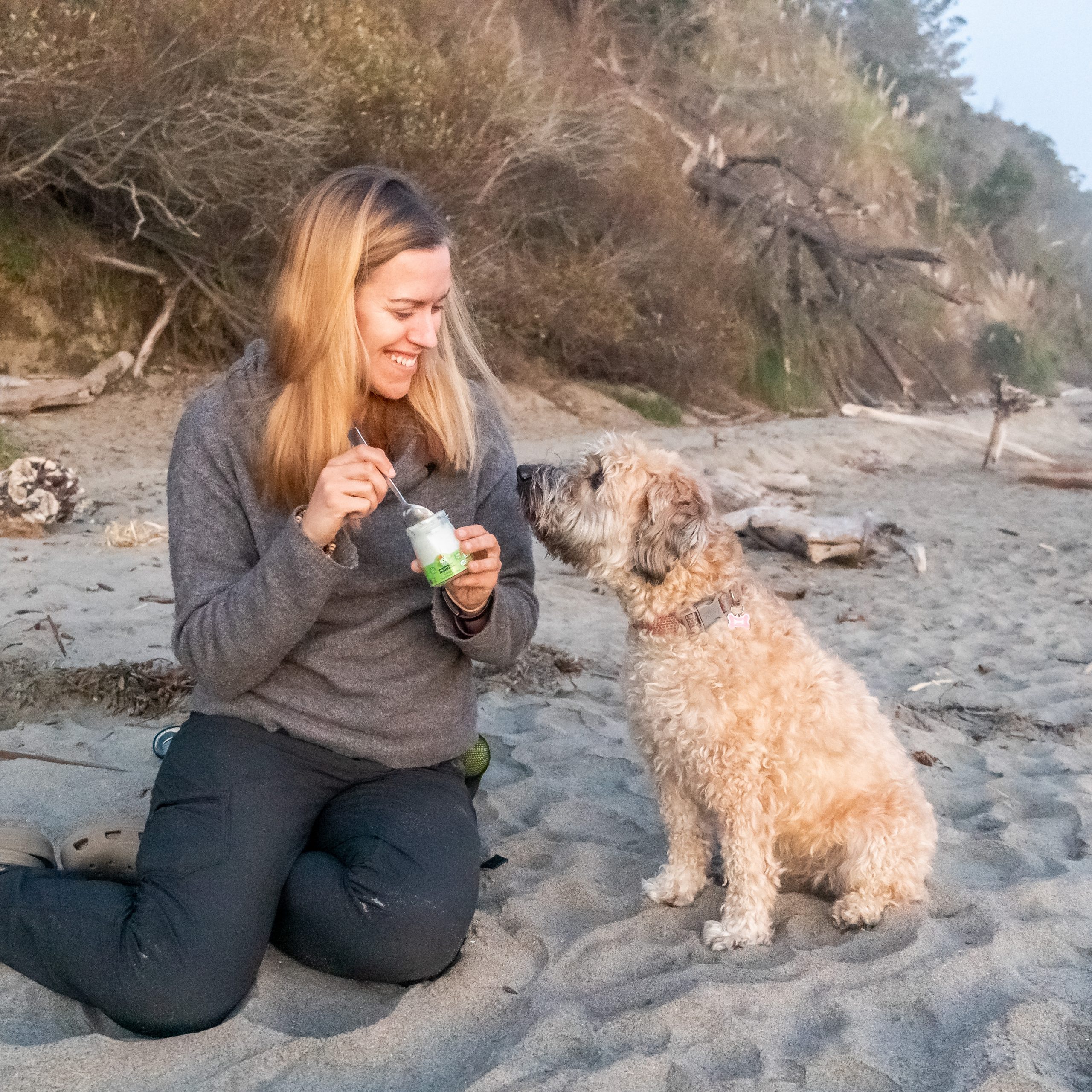 Me and my dog enjoying a snack on the beach