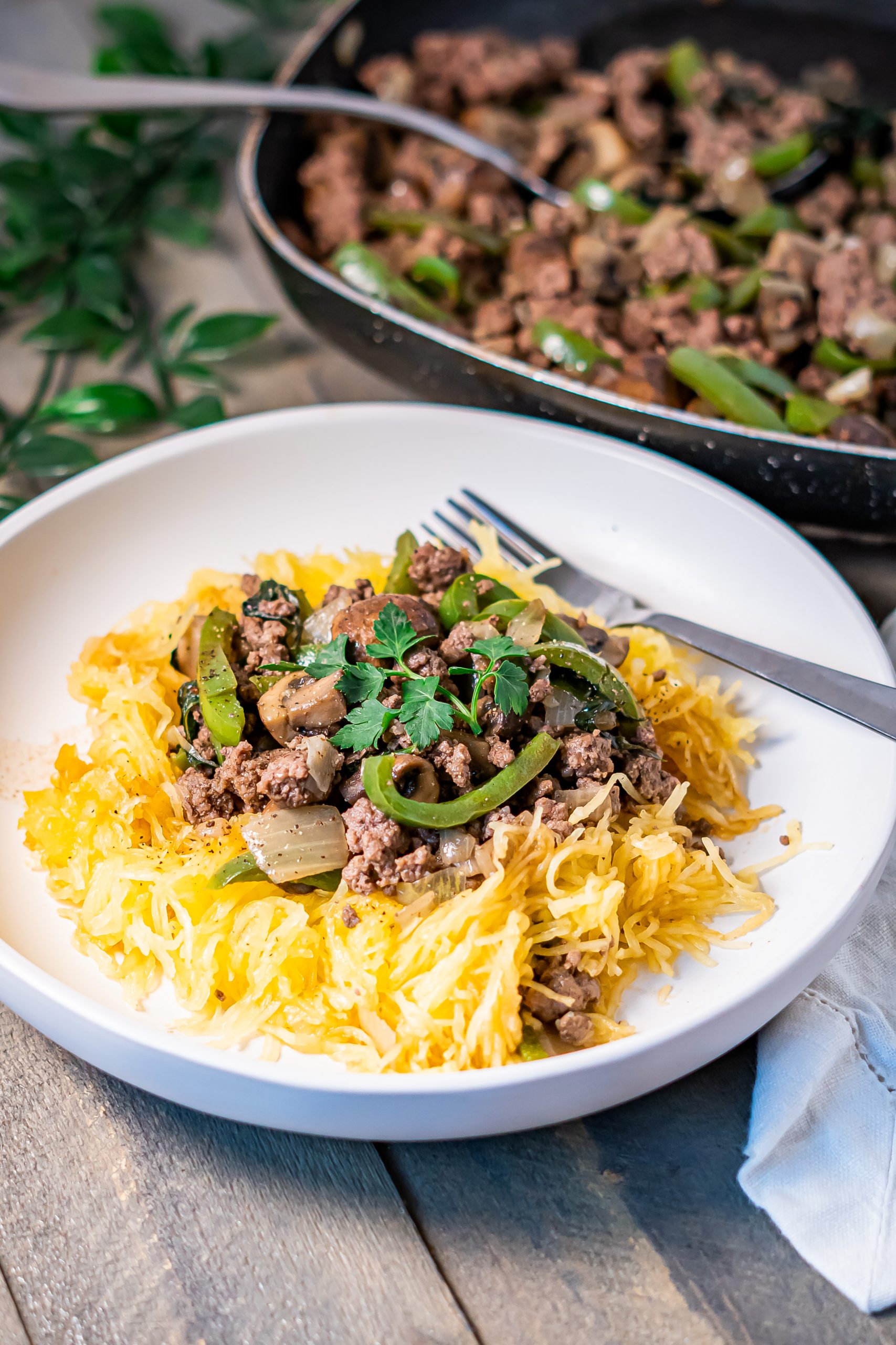 Baked spaghetti squash with beef and veggies served for easy weeknight dinner