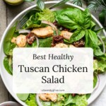 Bright salad with chicken and sun-dried tomatoes and "Tuscan Chicken Salad" text overlay.