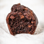 Close up of the inside of a gluten free chocolate muffin to show its moist texture.