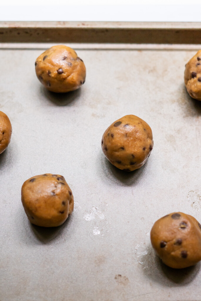 1 ½ inch balls of cookie dough on a baking sheet.