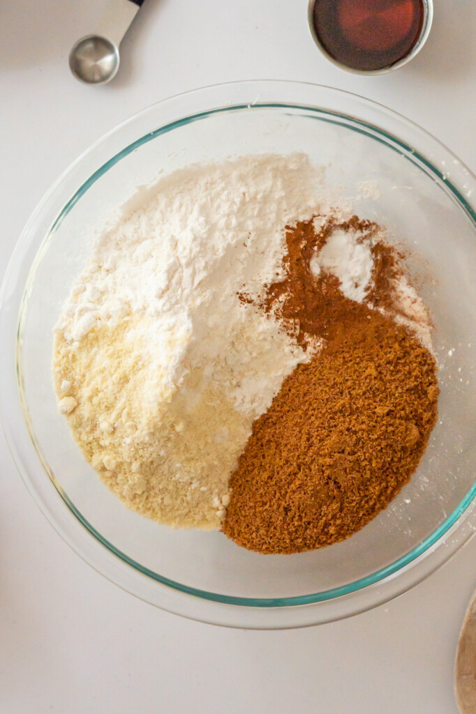 An overhead view of a bowl of all the un-mixed dry ingredients.