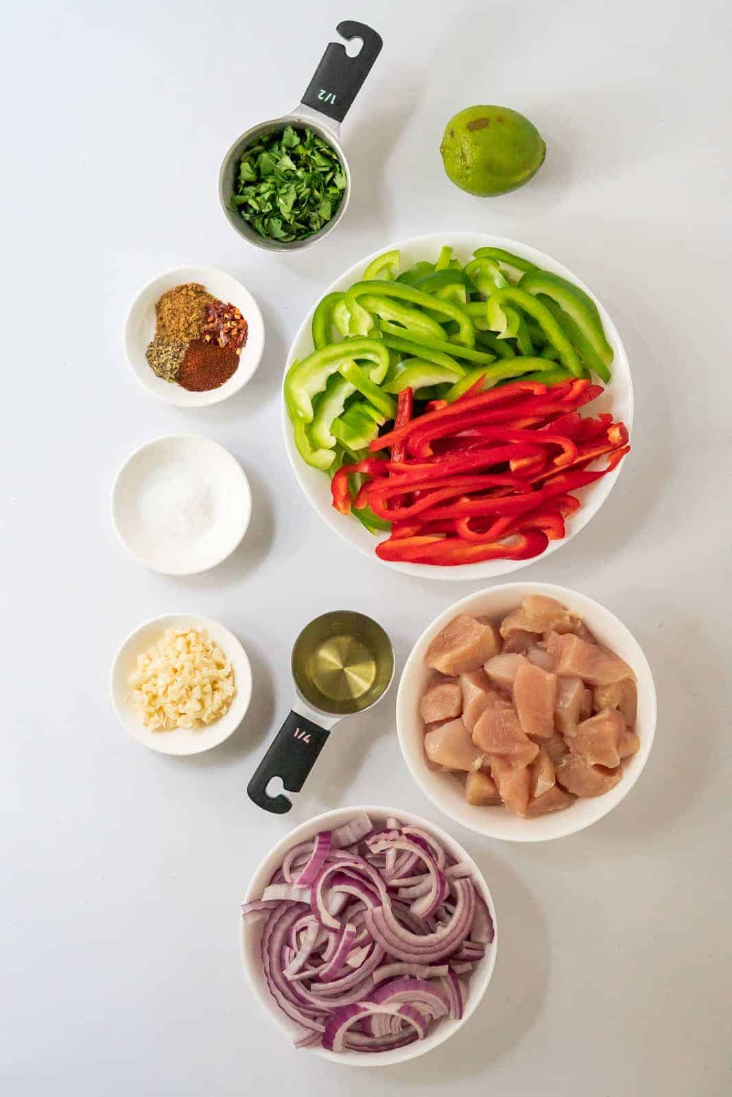 Overhead view of the 8 main ingredients plus 5 common spices needed to make this recipe.
