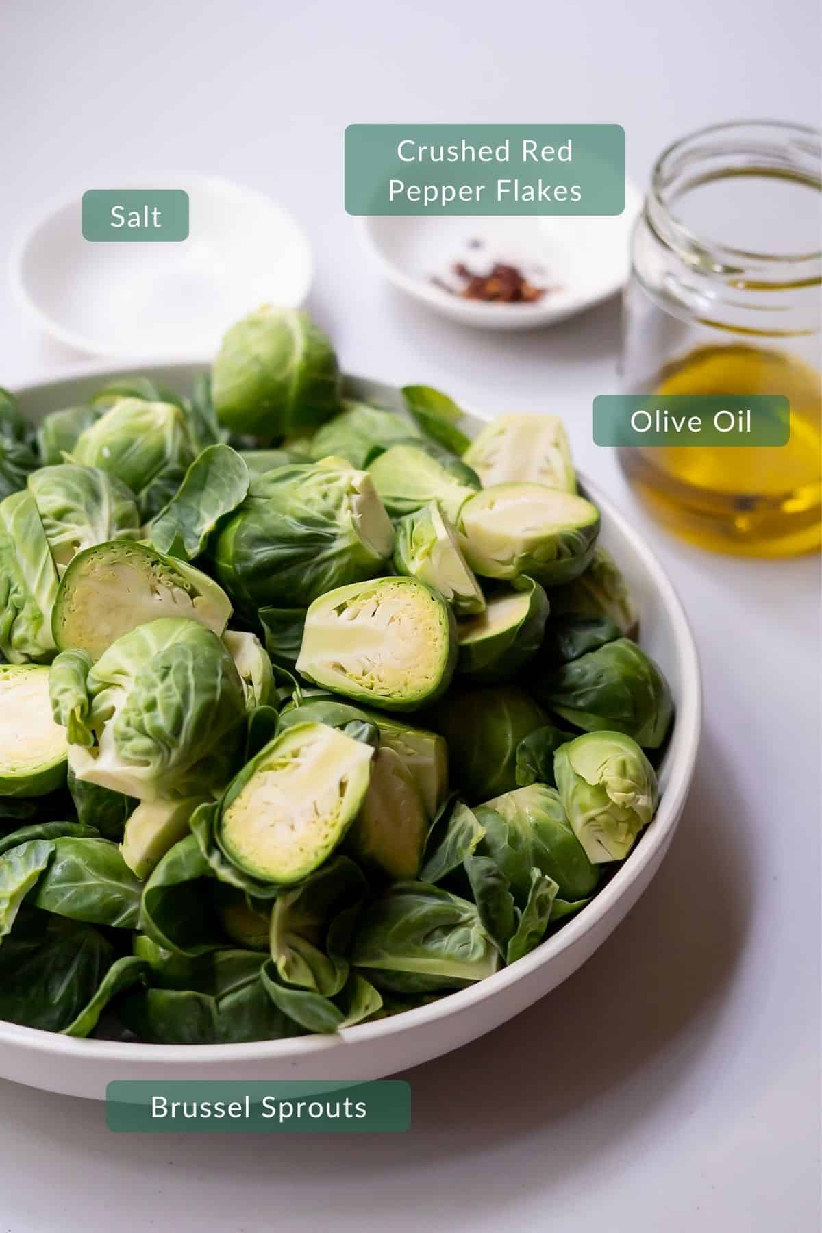 The four ingredients you need to make this recipe in correct measurements: brussel sprouts, olive oil, salt, and red pepper flakes.