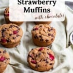 Six gluten free strawberry muffins with chocolate chips served with a side of dairy-free butter and a side of strawberries.