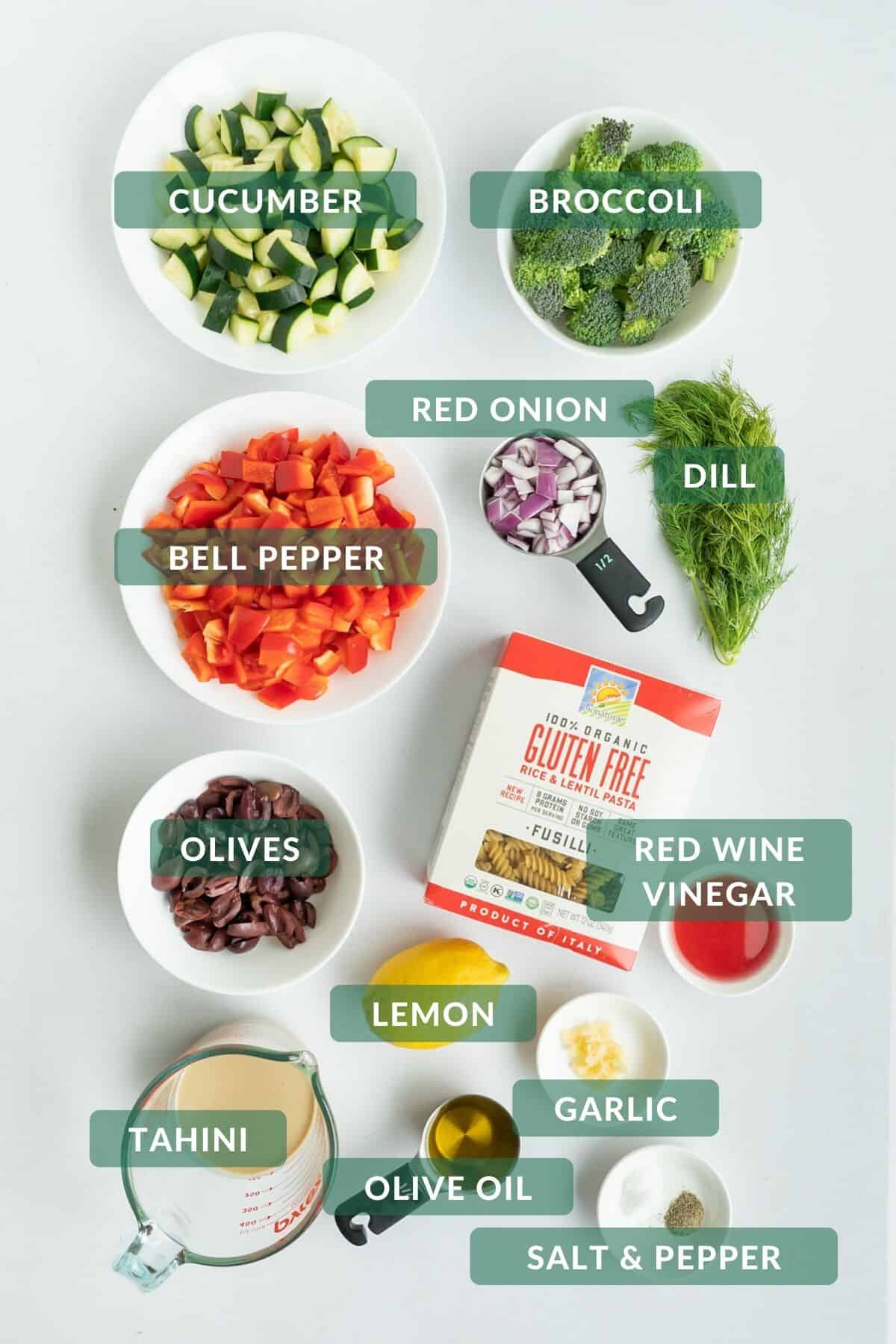 The 12 easy-to-find ingredients for tahini pasta salad laid out and ready to prep!
