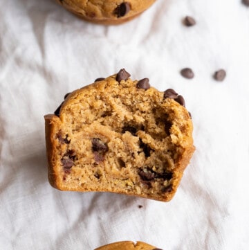 Half of a gluten free chocolate chip muffin to show the amazing fluffy and moist texture!