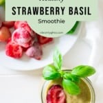 Overhead view of the strawberry basil smoothie with a plate of raw ingredients on the side.