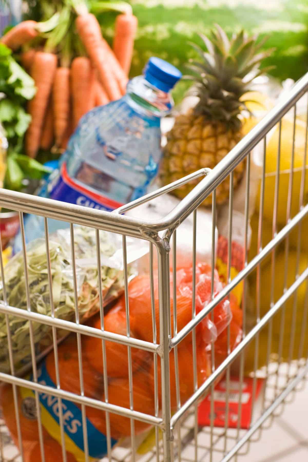 A grocery card with produce, water, fruits, and vegetables.