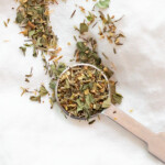 A teaspoon with an Italian seasoning substitute made of basil, oregano, rosemary, and thyme.