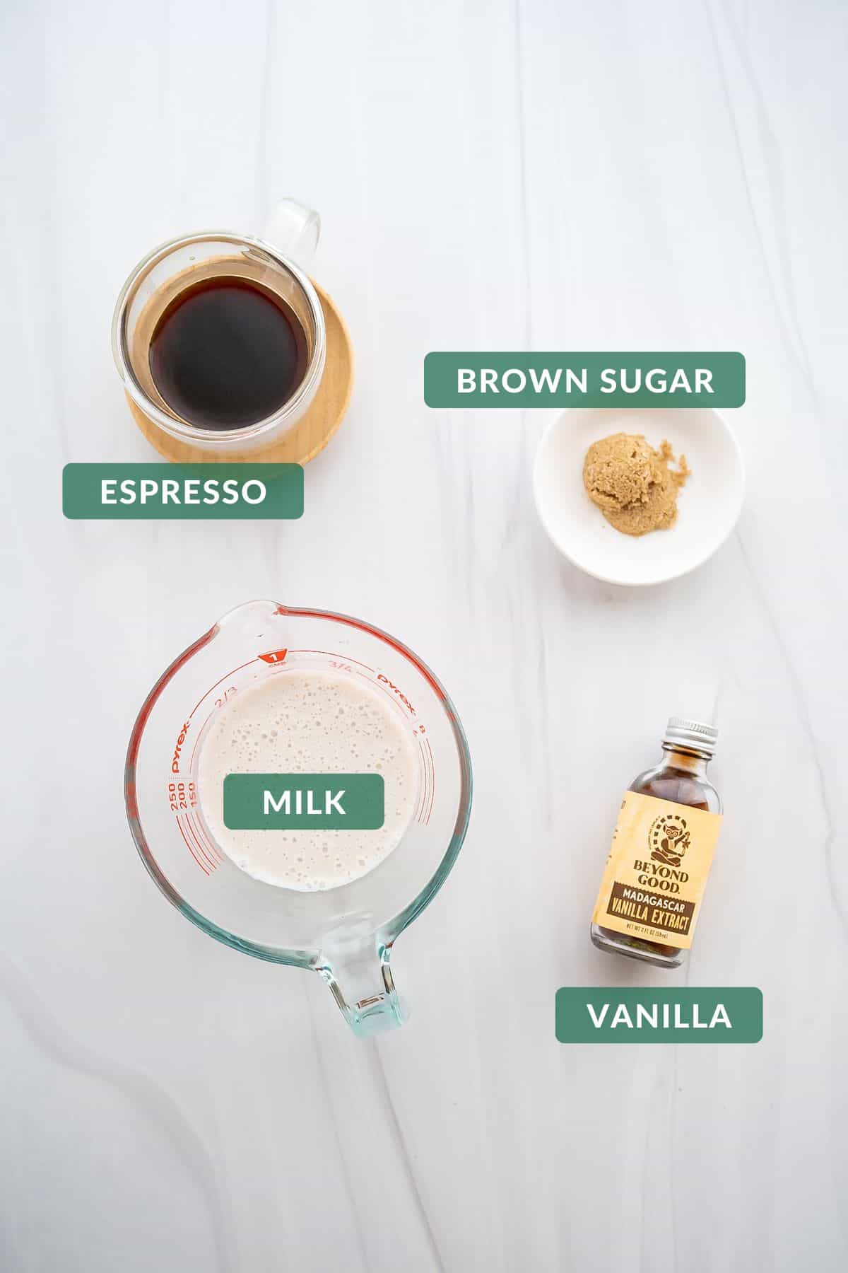 The 4 ingredients needed to make brown sugar shaken espresso: milk, brown sugar, espresso, and vanilla extract.