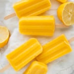 Healthy Mango popsicles arranged on a cloth napkin.