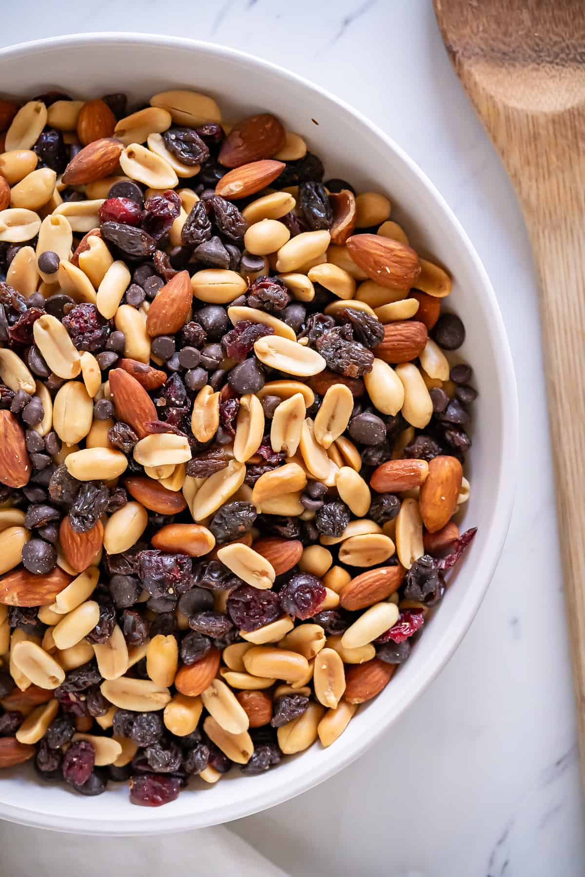 A shallow dish full of healthy trail mix.