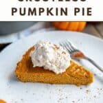 A piece of crustless pumpkin pie with whipped cream and spice on top.