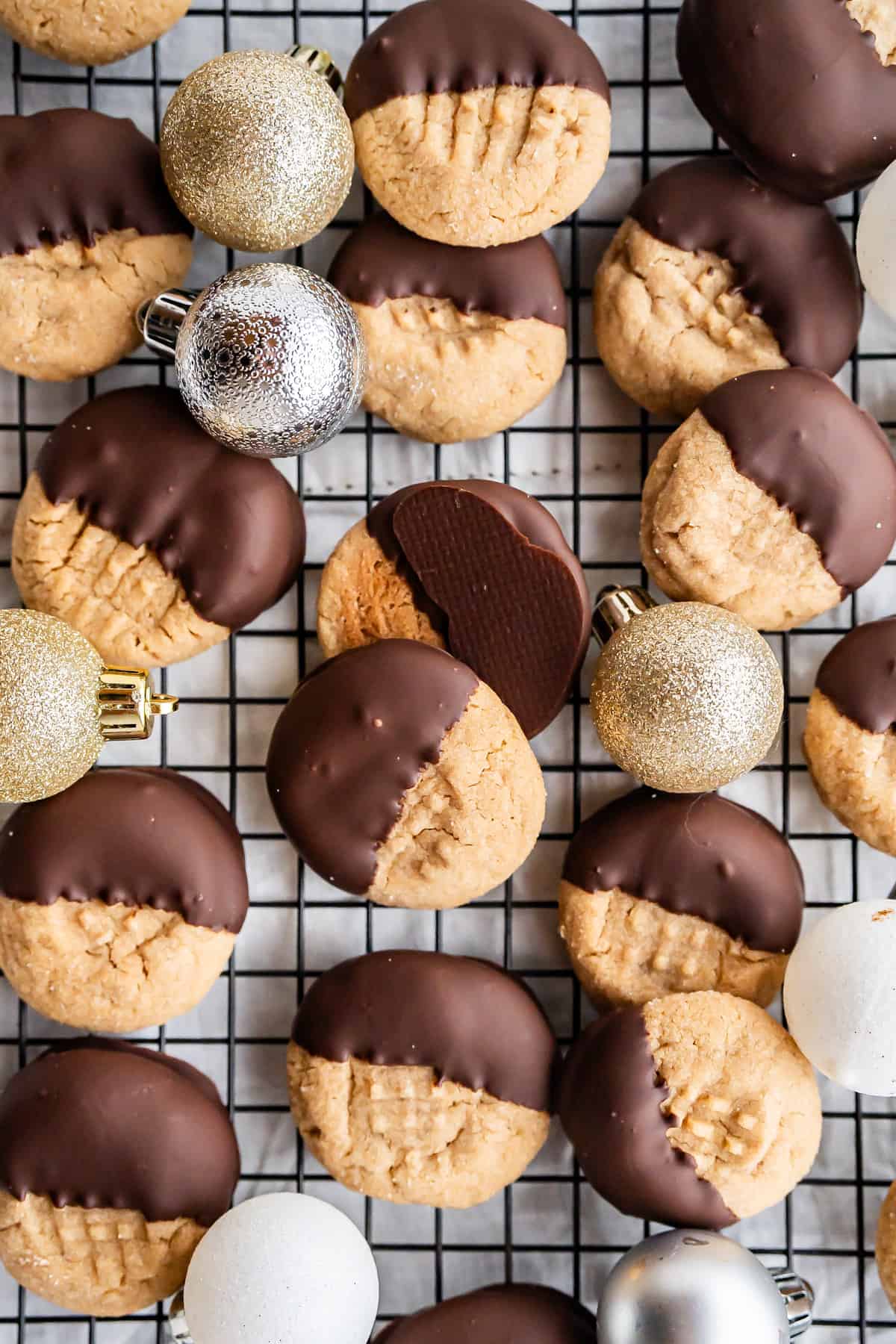 Decoratively arranged gluten-free peanut butter cookies dipped in chocolate.