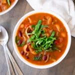 A colorful bowl of instant pot minestrone soup filled with healthy vegetables.