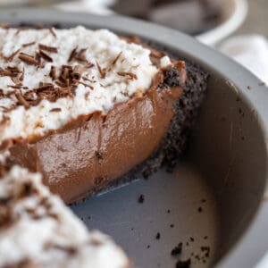 A close up of the smooth chocolate custard filling of a vegan chocolate pie.