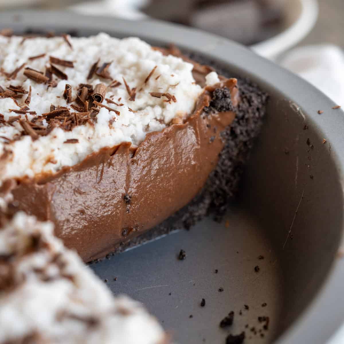 A close up of the smooth chocolate custard filling of a vegan chocolate pie.