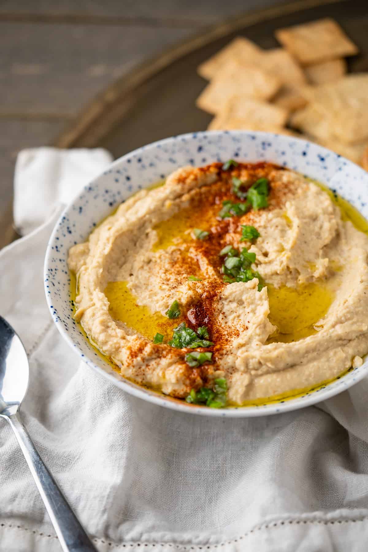 A close up of homemade chickpea hummus to show the creamy texture.