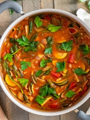 A large freshly made pot of healthy vegan minestrone soup.
