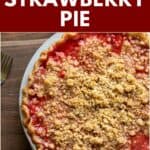 A close up of the crumb topping and strawberry filling in a baked strawberry crumble pie.