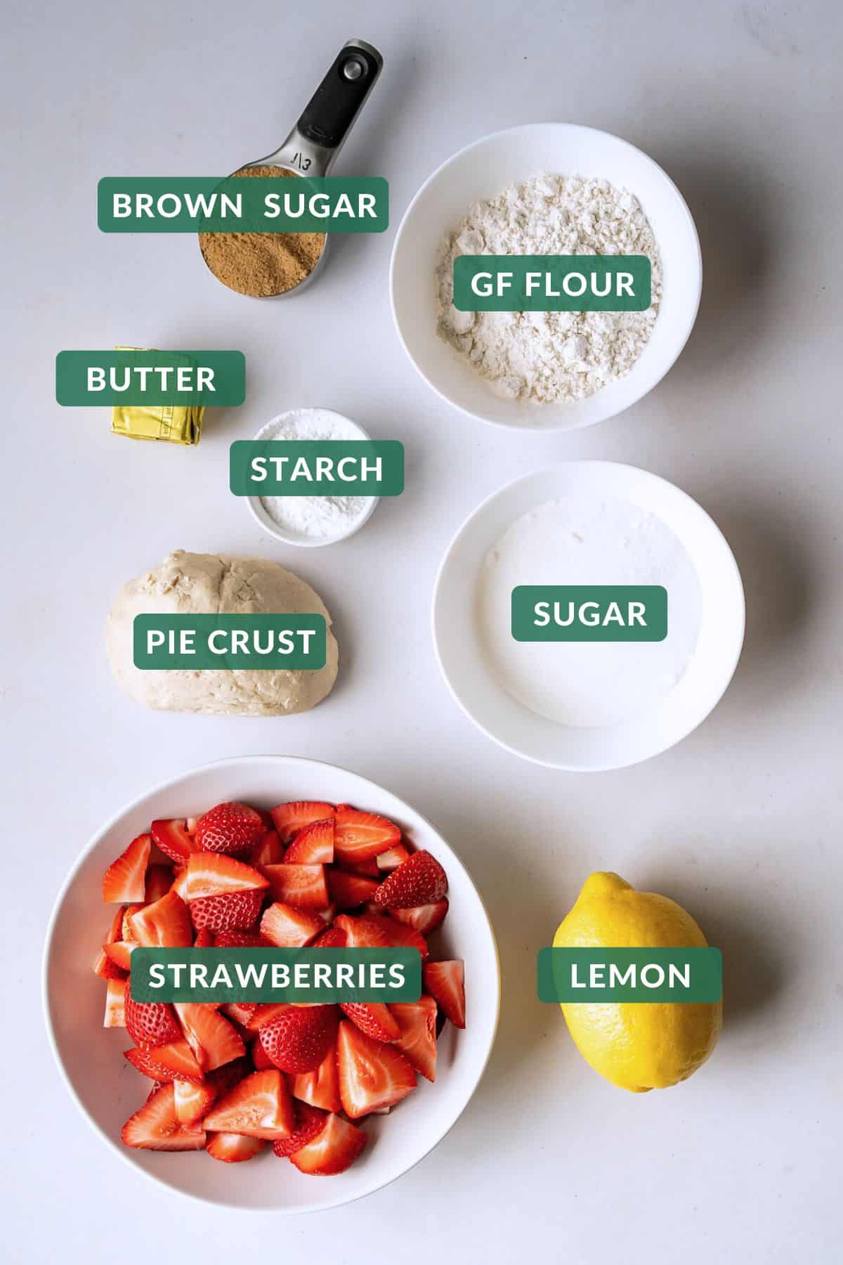 The 8 common ingredients needed to make a baked strawberry pie with crumb topping.