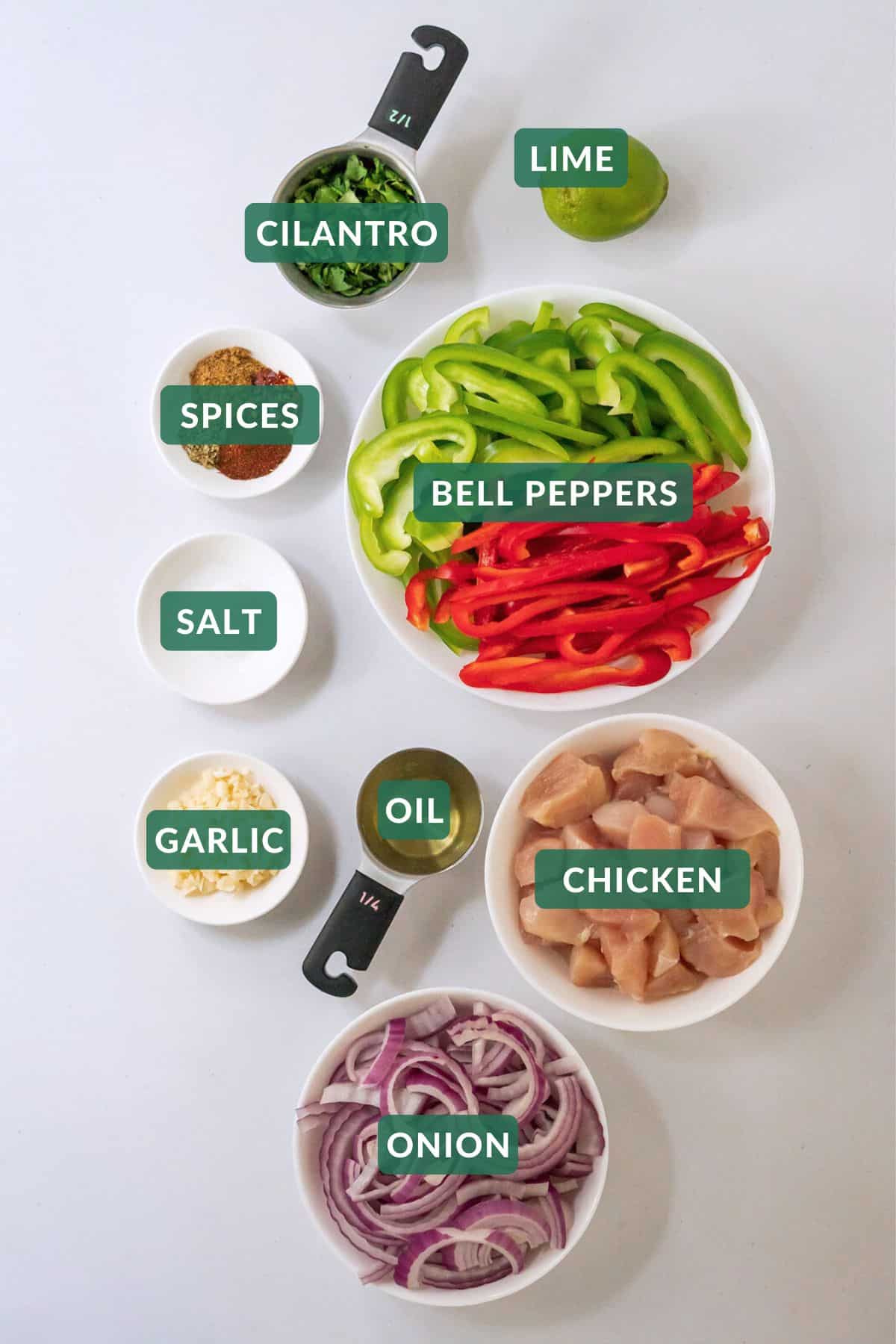 The 8 main ingredients and spices needed to make healthy baked chicken fajitas.