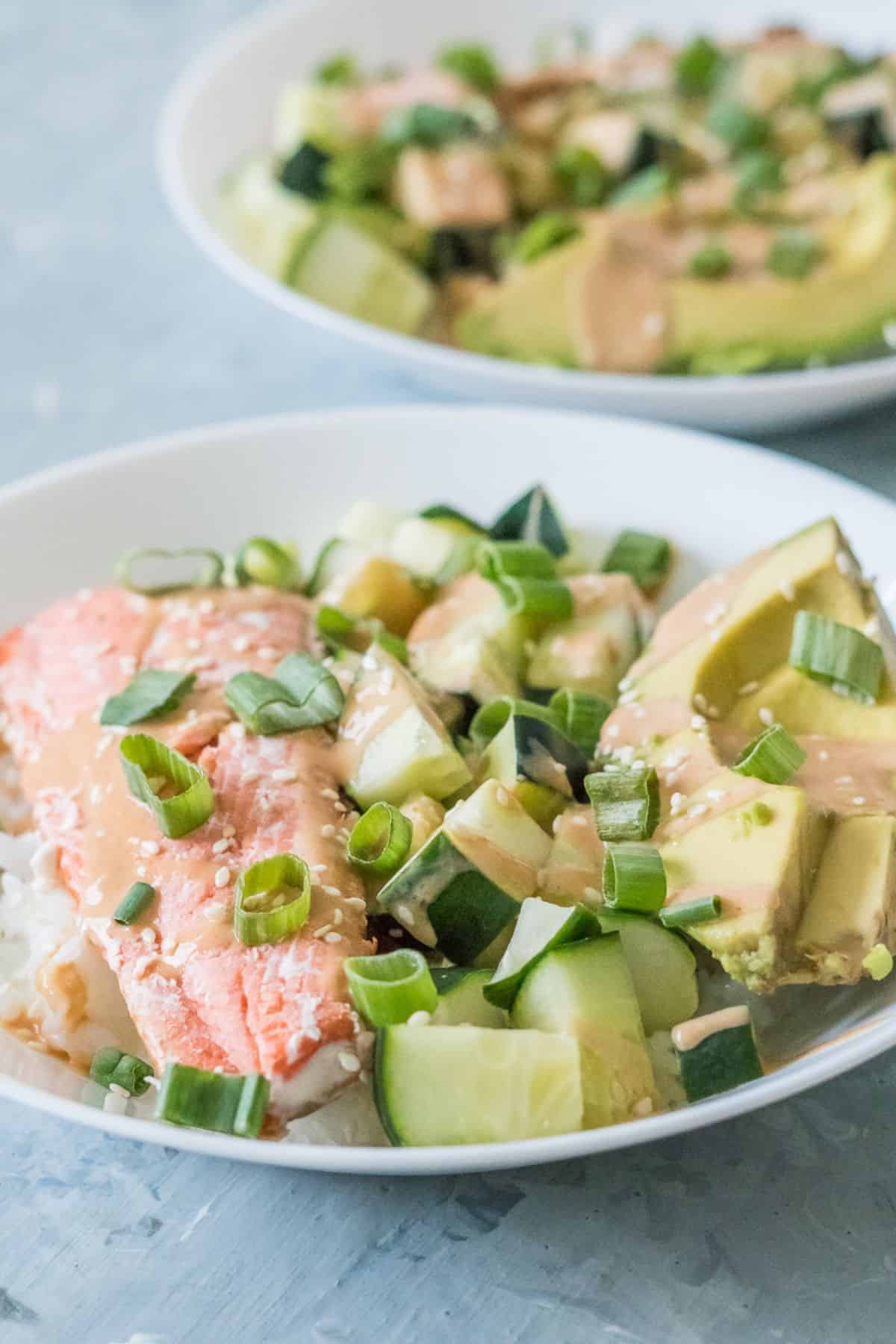 A close up of a salmon sushi bowl to show the variety of the textures.