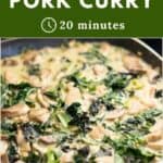 A close up of a pan of green pork curry with kale and mushroom in a creamy coconut sauce.
