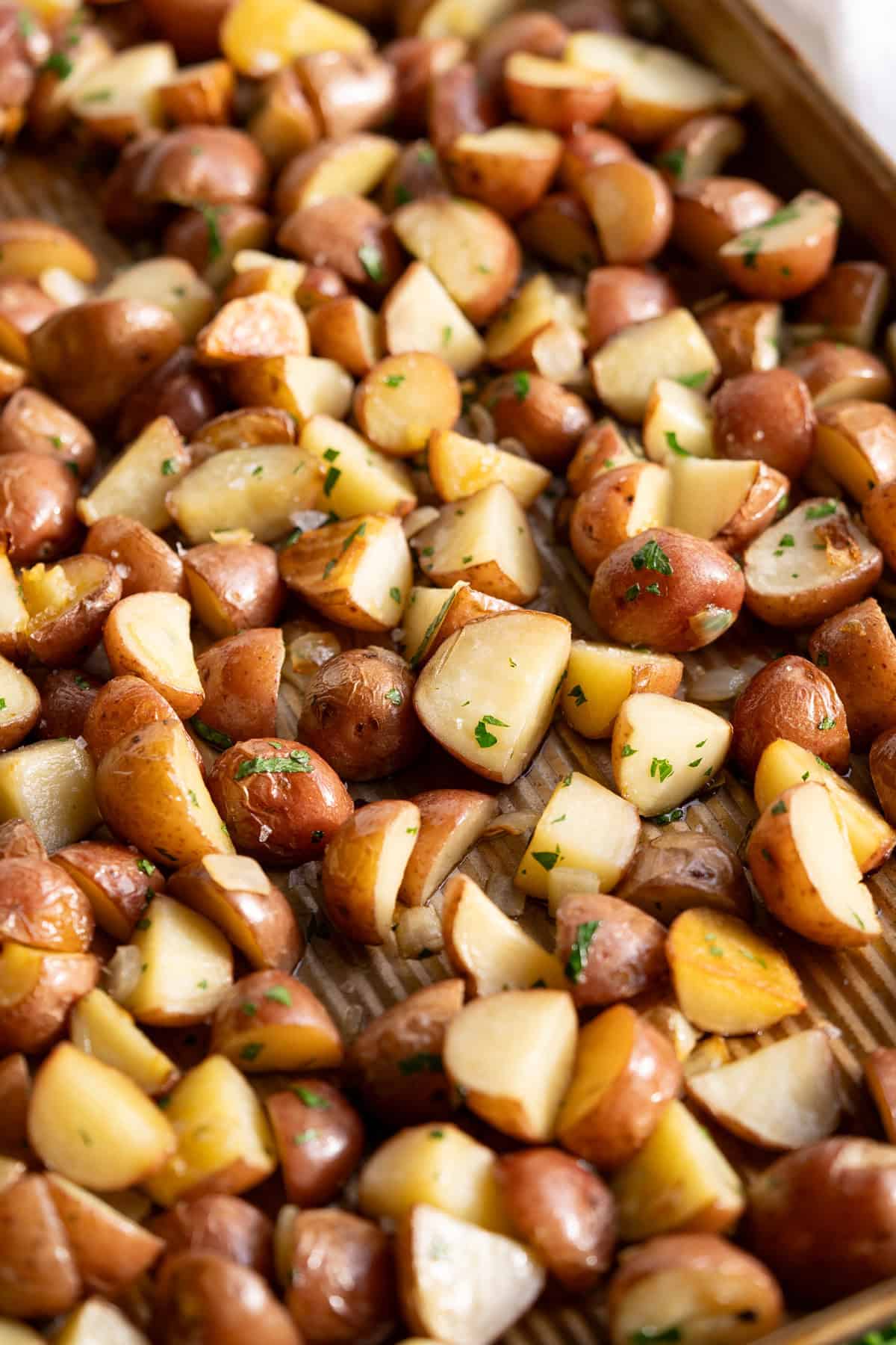 Crispy roasted red new potatoes tossed with parsley and onion.