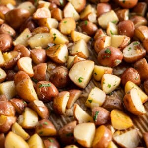 Crispy roasted red new potatoes tossed with parsley and onion.