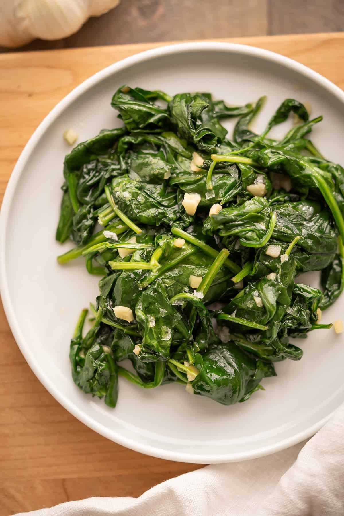 A serving plate of sautéed garlic spinach.