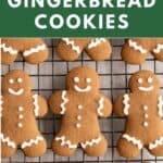 Iced gluten-free gingerbread cookies cut into a gingerbread man shape.
