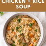 A serving bowl of Instant Pot chicken and rice soup with chopped parsley to garnish.