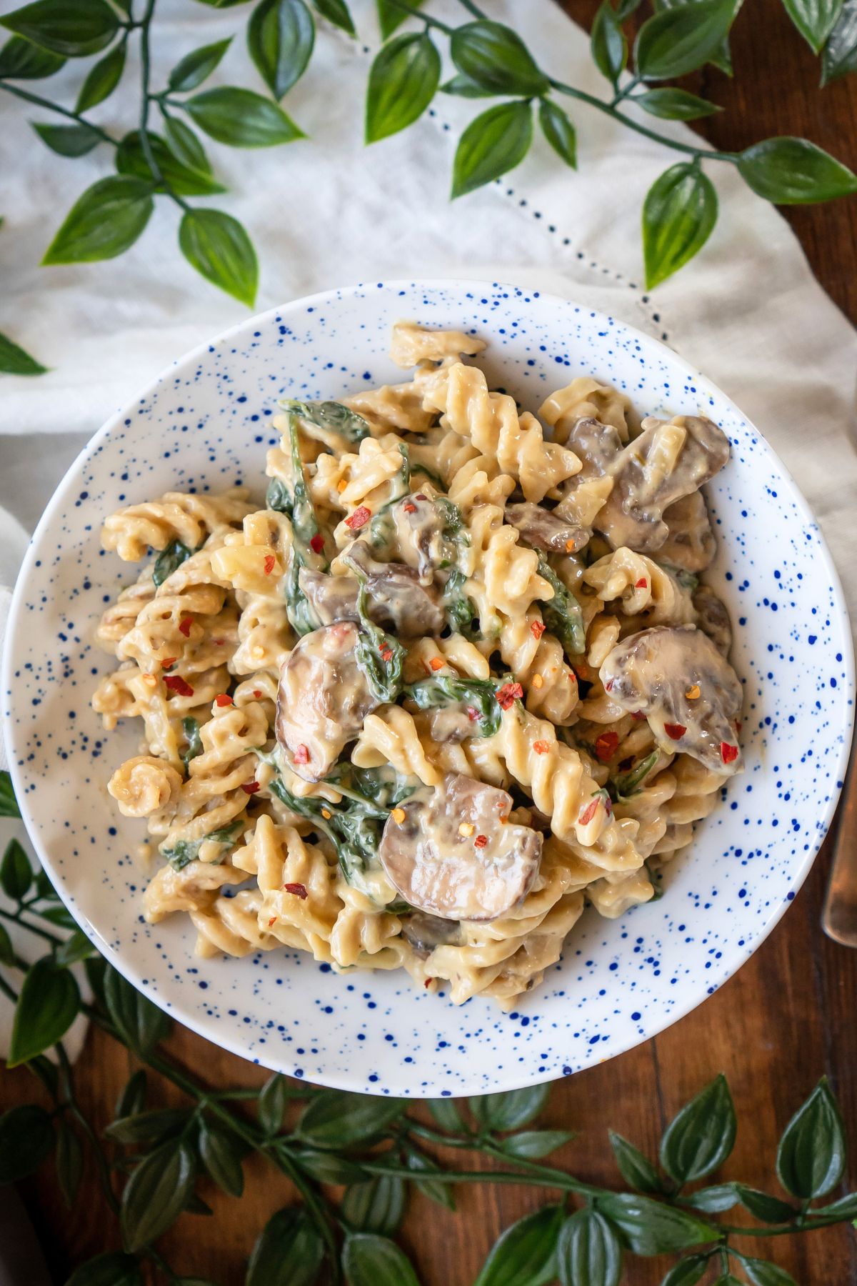 A serving bowl of creamy vegan mushroom pasta.
