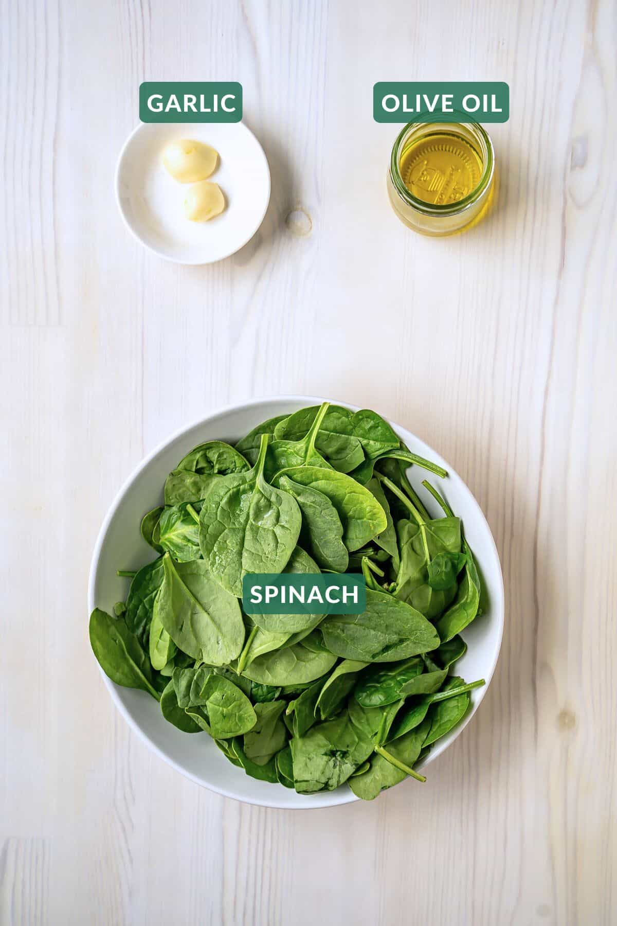 The three ingredients needed to make sauteed garlic spinach.