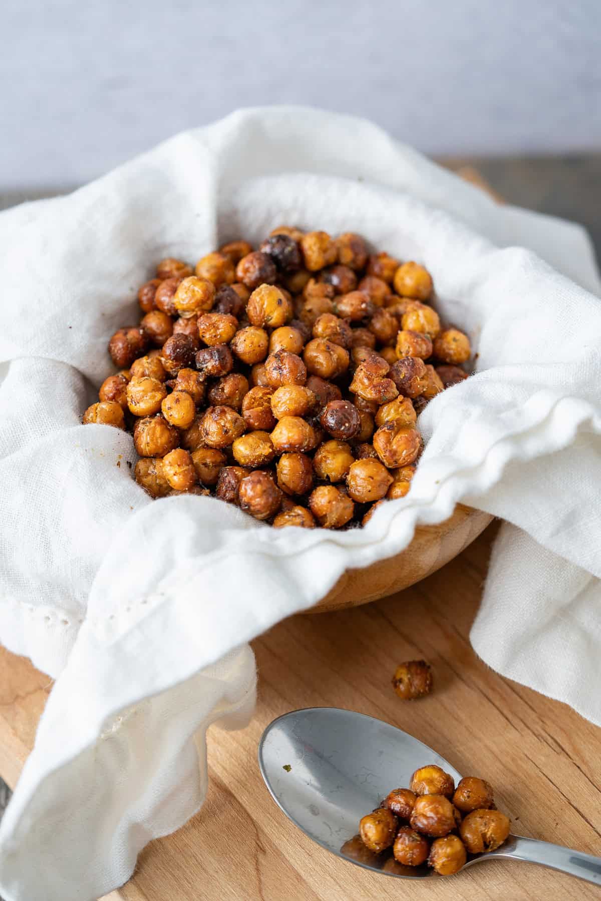 A serving bowl of crispy roasted chickpeas.