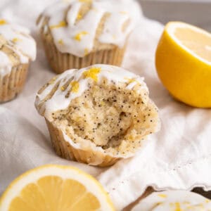 The moist and soft inside of a gluten-free lemon poppyseed muffin with lemon glaze.