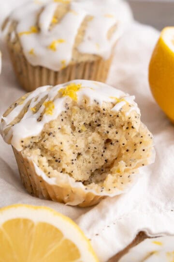 The moist and soft inside of a gluten-free lemon poppyseed muffin with lemon glaze.
