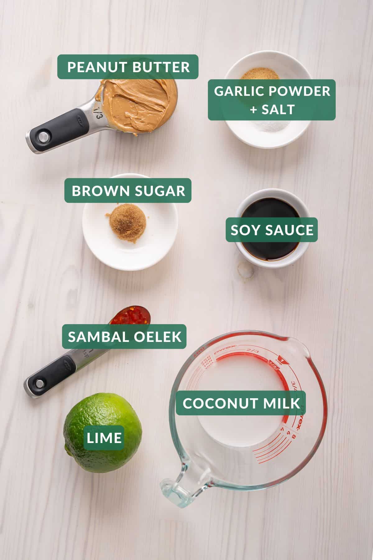 The 7 ingredients needed to make homemade Thai peanut butter sauce.