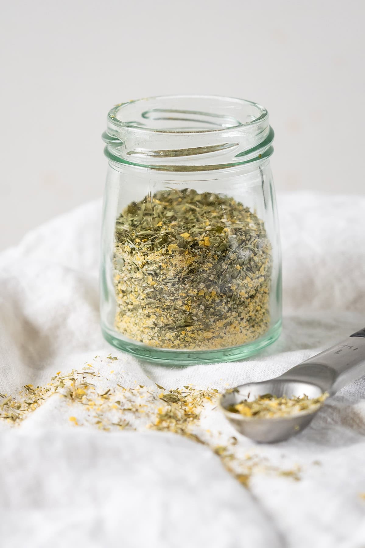 Homemade vegan ranch seasoning mix in a spice jar.