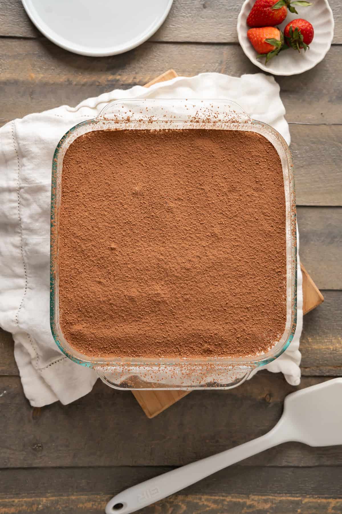 The cocoa dusting the top of a vegan tiramisu.