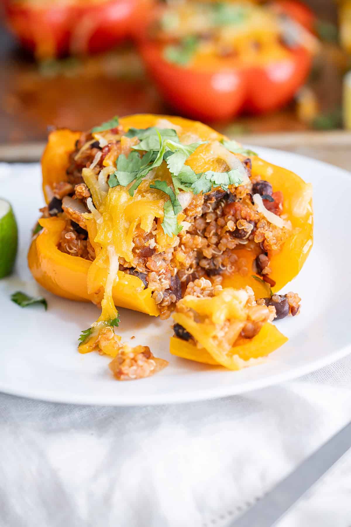 The inside of a stuffed quinoa bell pepper to show the layers and filling components.