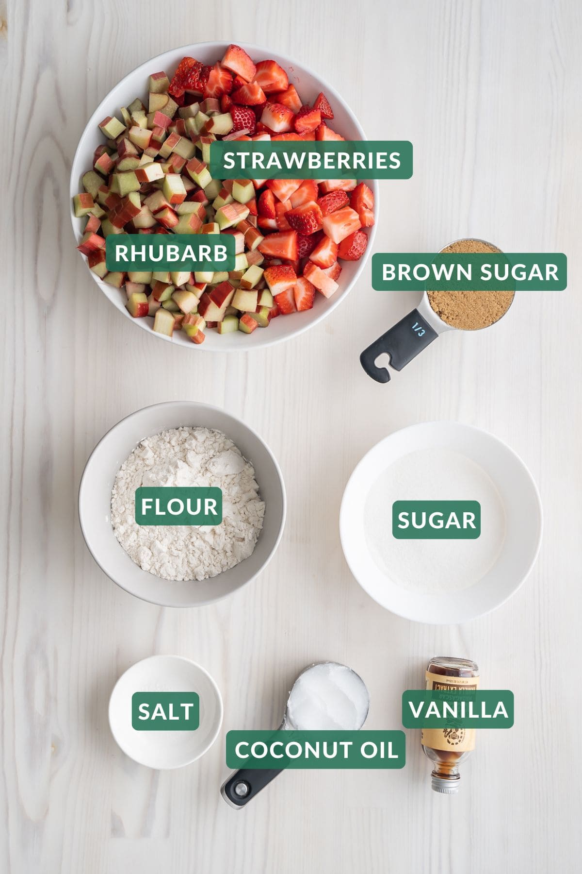 The ingredients needed to make strawberry rhubarb crumble.