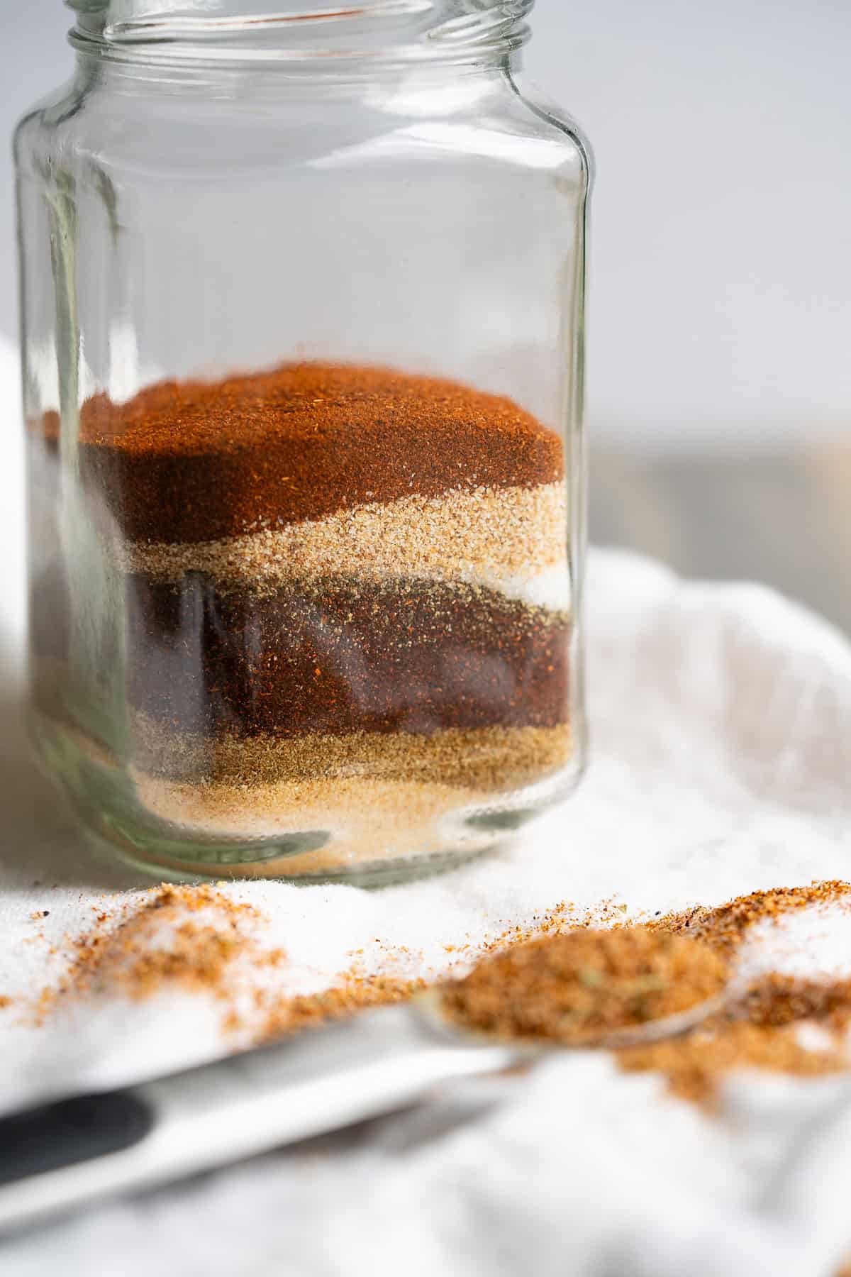 A jar of Mexican seasonings layered in a jar like sand art.