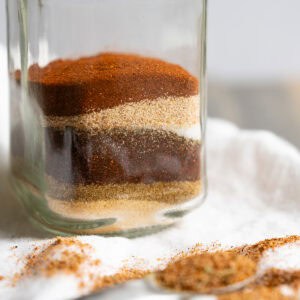 A jar of Mexican seasonings layered in a jar like sand art.