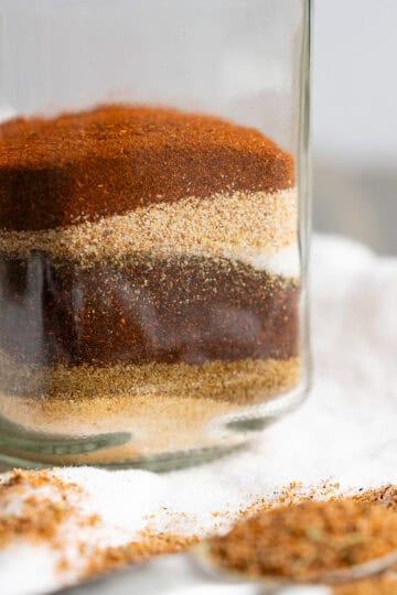 A jar of Mexican seasonings layered in a jar like sand art.