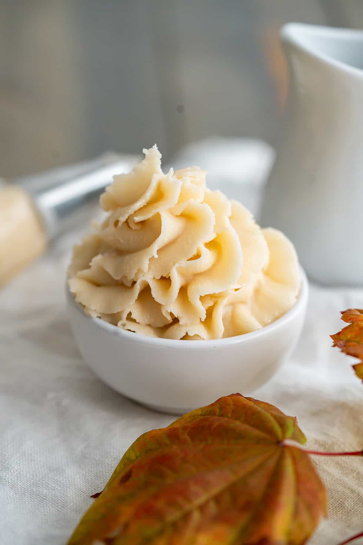 A tall tower of piped maple buttercream frosting.