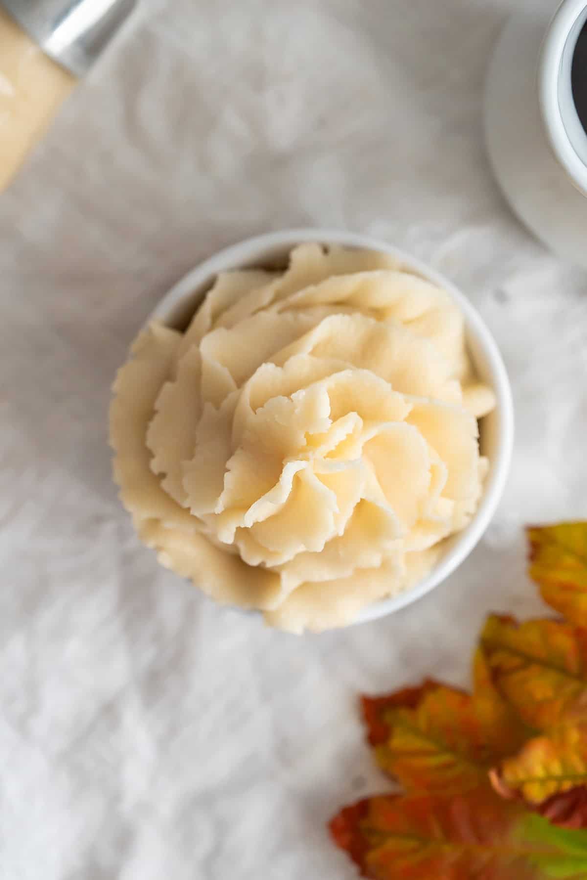 A bowl of piped maple buttercream frosting.